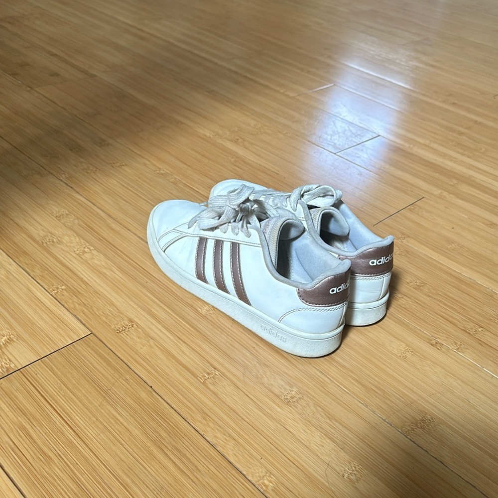 Adidas women’s rose gold loved 5 and 1/2 sneakers.